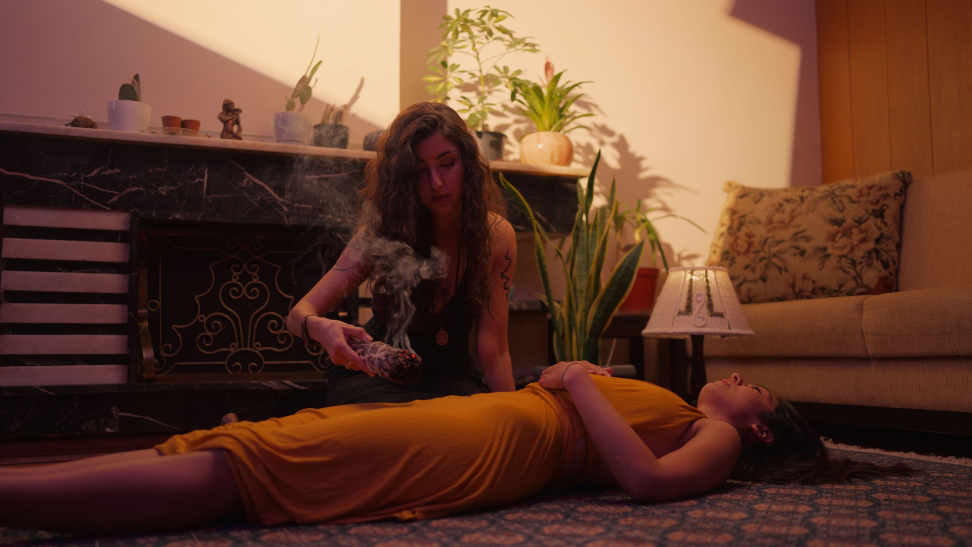 Woman using sage for practicing alternative therapy and meditation